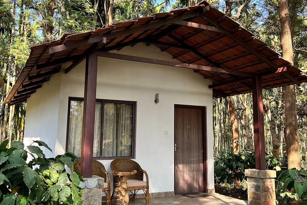 A small home painted white with wood trim